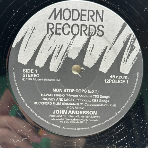 144 - A 12 inch vinyl album by John Anderson - Non Stop Cops