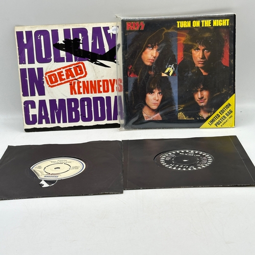 233 - 4x 7 inch single records - Dead Kennedys - Holiday in Cambodia, Kiss - Turn on the Night, Undertones... 