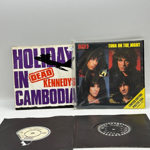 233 - 4x 7 inch single records - Dead Kennedys - Holiday in Cambodia, Kiss - Turn on the Night, Undertones... 