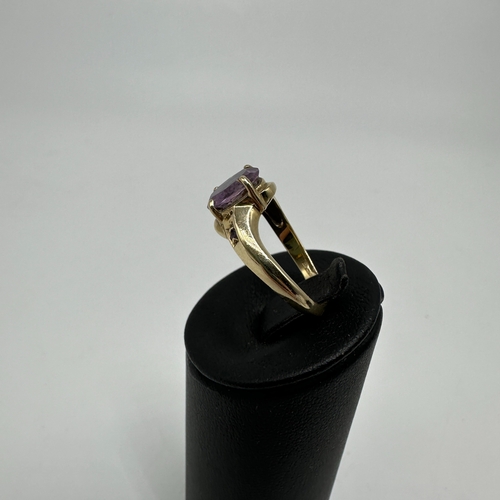 24 - A 9ct yellow gold amethyst dress ring, approx 3 grams, amethyst stones on the shoulders too, size N,... 