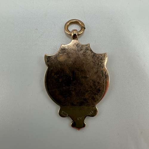 30 - A 9ct yellow gold Victorian pigeon racing medal, 44mm x 24mm, enamel design of a pigeon, weight  7.4... 