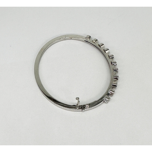5 - An 18ct white gold diamond bangle, approx 1.10ct in total each stone approx 0.10ct, 7 1/2 inch wide,... 