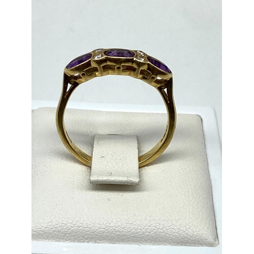 10 - An 18ct yellow gold amethyst & diamond dress ring, 2.9 grams in weight approx, size O