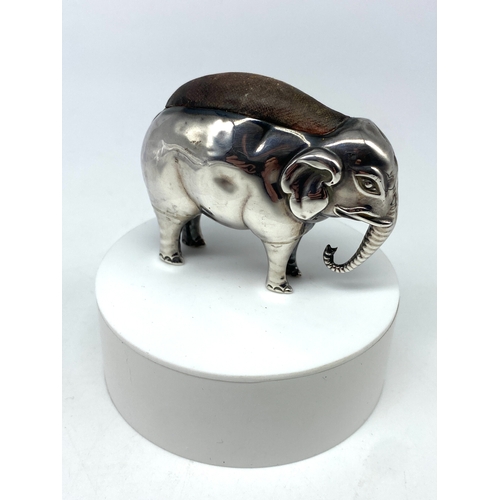 108 - A large silver elephant pin cushion, Birmingham 1906 Sydney & Co. in fair condition, has a few dents... 