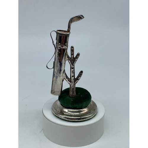 113 - An unusual silver golf bag hat pin holder, ring holds & pin cushion set, Birmingham 1911 by Sydney &... 