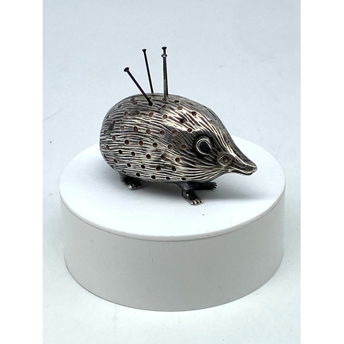 119 - A hedgehog pin cushion, Birmingham 1906 by Saunders & Shepherd, slight dents to sides, in fair condi... 