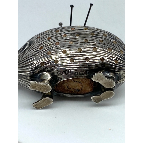 119 - A hedgehog pin cushion, Birmingham 1906 by Saunders & Shepherd, slight dents to sides, in fair condi... 