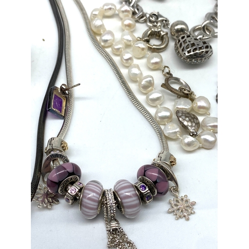 144 - A mixed lot of silver jewellery items, Pandora necklace - 60grams approx weight, silver shell neckla... 