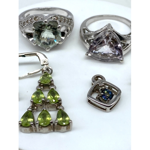 149 - A mixed lot of silver, rings & pendants, 23.9 grams approx weight, rings are size N