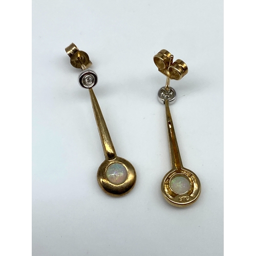 15 - A pair of 9ct yellow gold opal & diamond drop earrings, 2 grams in weight approx, 22mm drop