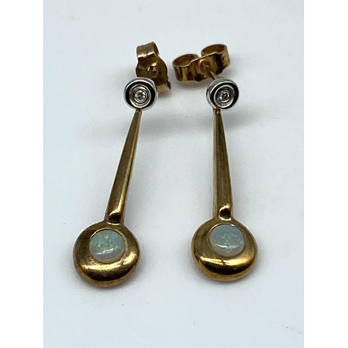 15 - A pair of 9ct yellow gold opal & diamond drop earrings, 2 grams in weight approx, 22mm drop