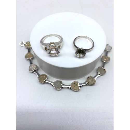 153 - A mixed lot of silver items, bracelet & rings, 28 grams approx weight, 8 inche long, rings are size ... 