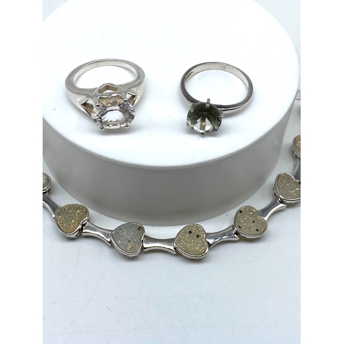 153 - A mixed lot of silver items, bracelet & rings, 28 grams approx weight, 8 inche long, rings are size ... 