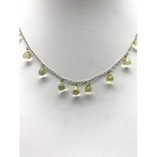 162 - A lemon quartz silver necklace and a heart necklace