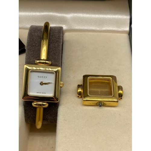 185 - A ladies Gucci watch, in original box with papers, will require a battery, 18mm dial,