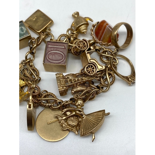 20 - A 9ct yellow gold charm bracelet, 14 charms, all fully hallmarked, 47.2 grams total approx weight,