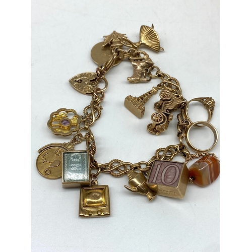 20 - A 9ct yellow gold charm bracelet, 14 charms, all fully hallmarked, 47.2 grams total approx weight,