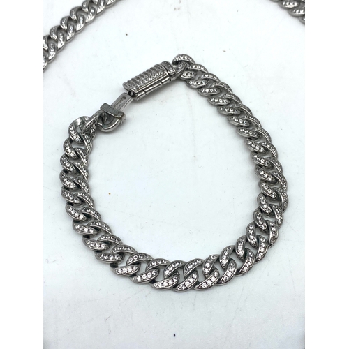 214 - A white metal curb bracelet & chain, both items are encrusted with stones, necklace 17 1/2 inches lo... 