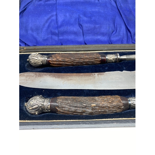 221 - A stag horn carving set, in original case, buyer must collect or arrange own shipping,