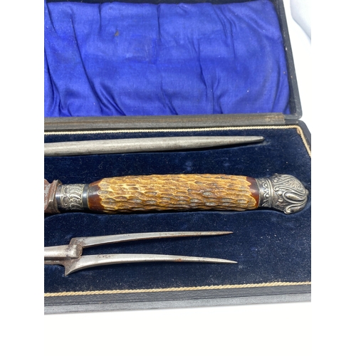 221 - A stag horn carving set, in original case, buyer must collect or arrange own shipping,