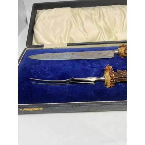 222 - A deer horn carving set, in original case, buyer must collect or arrange shipping