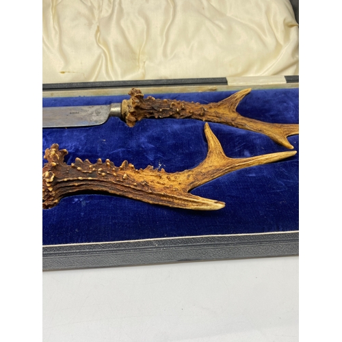 222 - A deer horn carving set, in original case, buyer must collect or arrange shipping