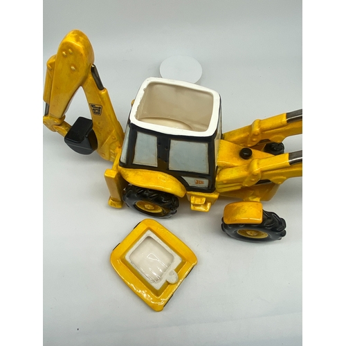 227 - A JCB digger teapot, 8 1/2 inches high x 15 inches long, no chips or damage