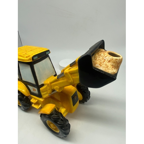 227 - A JCB digger teapot, 8 1/2 inches high x 15 inches long, no chips or damage