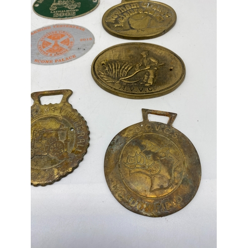 250 - A collection of brass plates