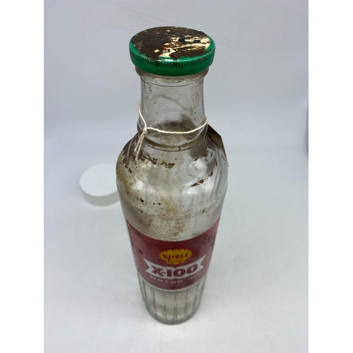 261 - A Shell Esso oil bottle, thick glass, 13 1/3 inches tall x 3 1/4 inches wide