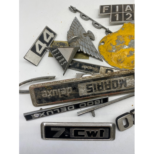 263 - A collection of car badges