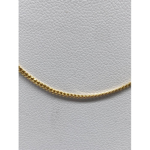 30 - A 9ct yellow gold fine curb chain, 15 inches long, 2.2 grams in weight approx