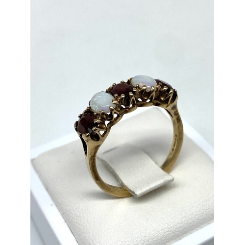 33 - A 9ct yellow gold opal & garnet dress ring, size P, 2.7 grams in weight approx