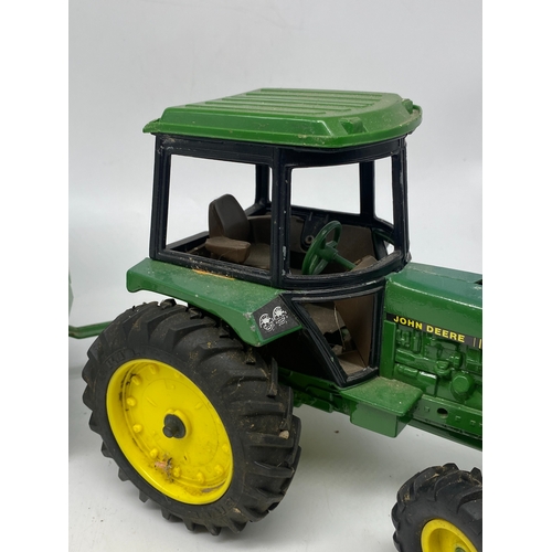 330 - A large John Deer model 2755 & a silage cart, these have been played with