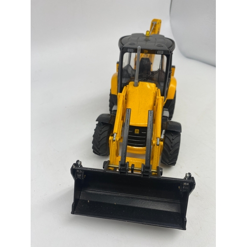 333 - A JCB digger toy, scale 1:25, has been on display