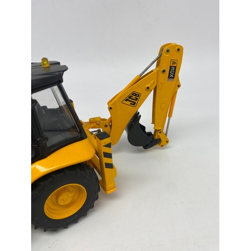 333 - A JCB digger toy, scale 1:25, has been on display