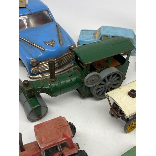 339 - A collection of vintage models, a Dinky bus, an amusement carriage, steam roller & others