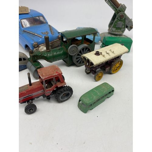 339 - A collection of vintage models, a Dinky bus, an amusement carriage, steam roller & others