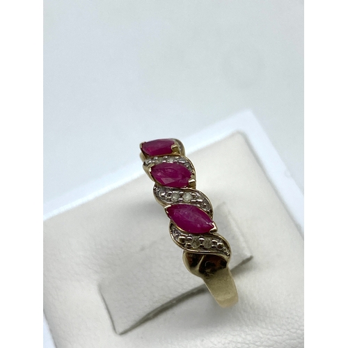 34 - A 9ct yellow gold ruby & diamond dress ring, size L, 2 grams in weight approx