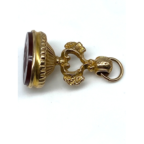 35 - A 9ct yellow gold Victorian watch fob, with a cornellian stone, 10.3 grams in weight approx, 35mm x ... 