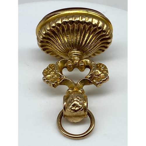 35 - A 9ct yellow gold Victorian watch fob, with a cornellian stone, 10.3 grams in weight approx, 35mm x ... 