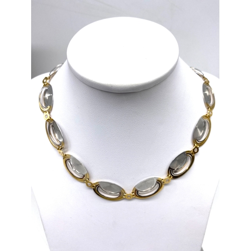 36 - An 18ct yellow & white gold fancy deco style necklace & matching bracelet, 45 grams combined approx ... 