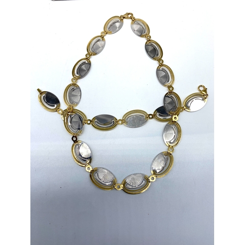 36 - An 18ct yellow & white gold fancy deco style necklace & matching bracelet, 45 grams combined approx ... 