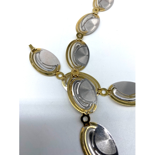 36 - An 18ct yellow & white gold fancy deco style necklace & matching bracelet, 45 grams combined approx ... 