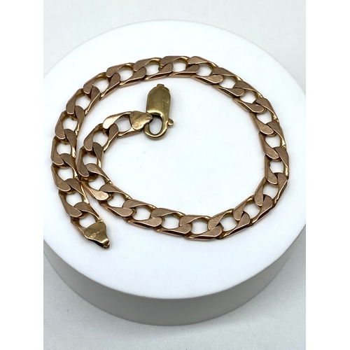 37 - A 9ct yellow gold curb bracelet, 15.4 grams approx weight, will need a solder repair at the trigger,... 