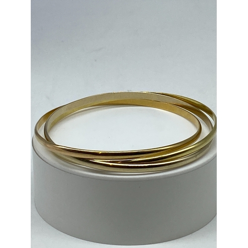 4 - An 18ct triple set bangle, 37 grams approx weight, size is approx 7 1/2 inches, bangles are not tota... 