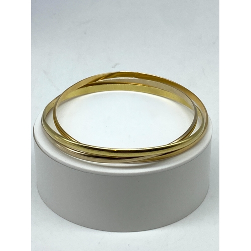 4 - An 18ct triple set bangle, 37 grams approx weight, size is approx 7 1/2 inches, bangles are not tota... 