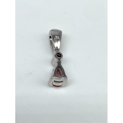 50 - An 18ct white gold pink sapphire & diamond pendant, no chain, 1.2 grams weight approx, 16mm x 3mm