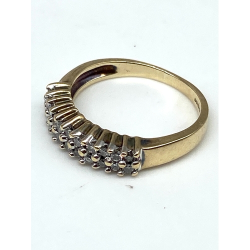 51 - A 9ct yellow gold diamond eternity band, size K, 2.6 grams in weight approx