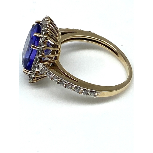 54 - A 9ct yellow gold triple A tanzanite & diamond ring, ring has been sized an dlost hallmark, weight i... 